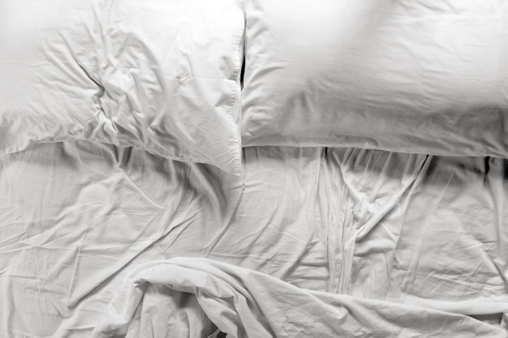 unmade, empty bed