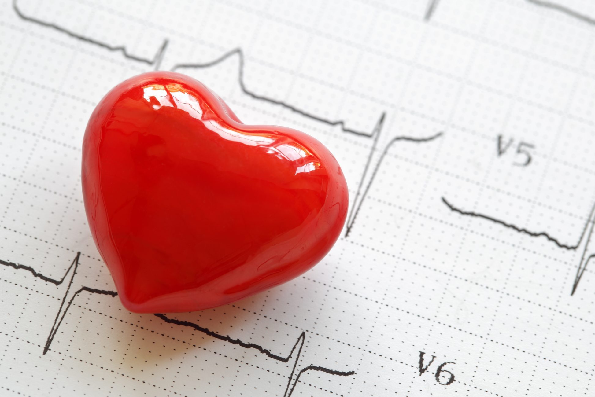 heart shape on top of Electrocardiograph